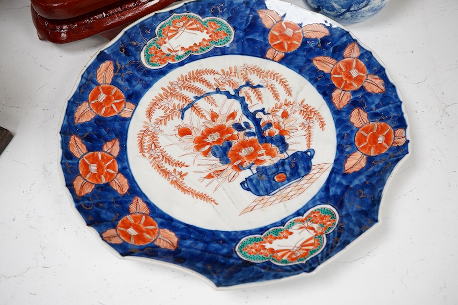 A Japanese Imari dish an Arita bottle vase together with a Chinese cloisonné enamel vase and a Chinese hardstone boulder carving, largest 34cm in diameter